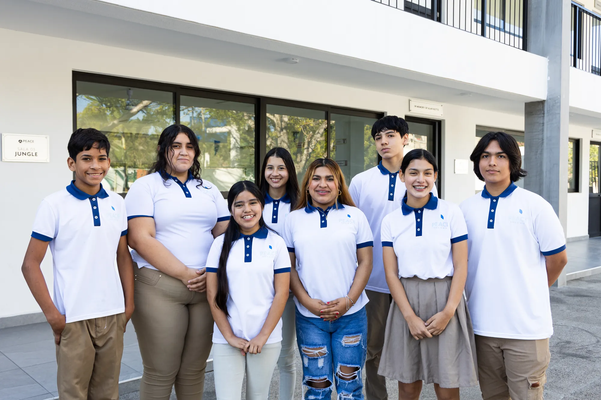 PEACE Punta de Mita students in uniform smiling together at Campus de Mita